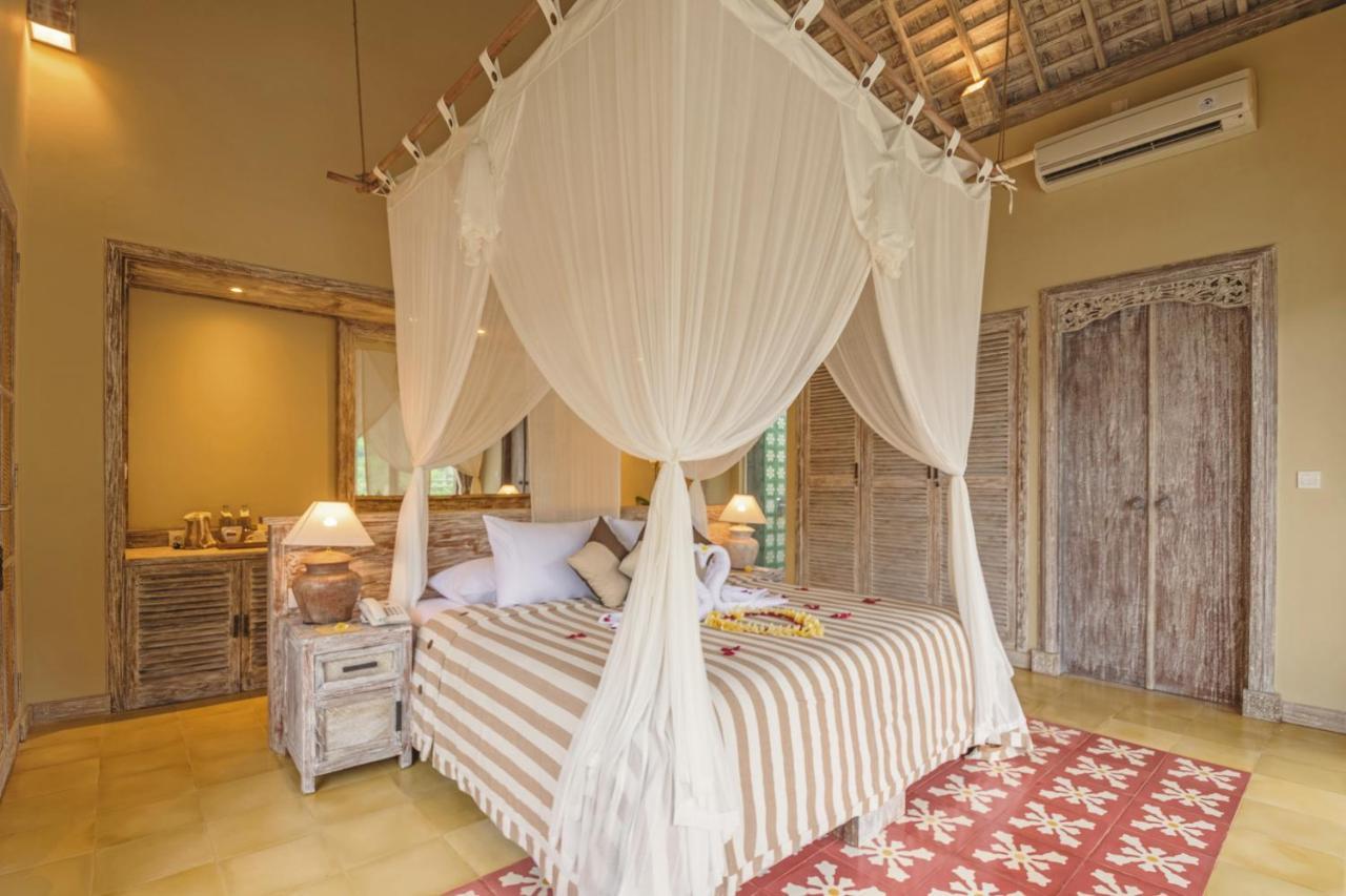Wapa Di Ume Sidemen Hotel Sidemen  Exterior photo A bed with a mosquito net